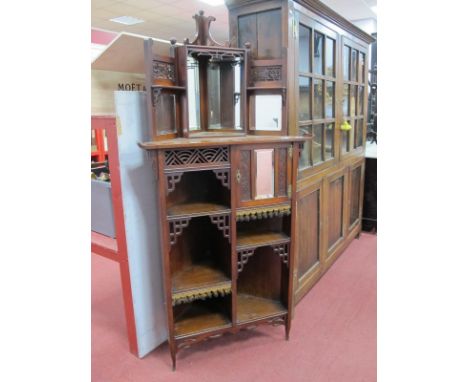 A Late XIX Century Chinese Style Walnut Freestanding Corner Display Stand, the top with applied 'C' scroll decoration and fou