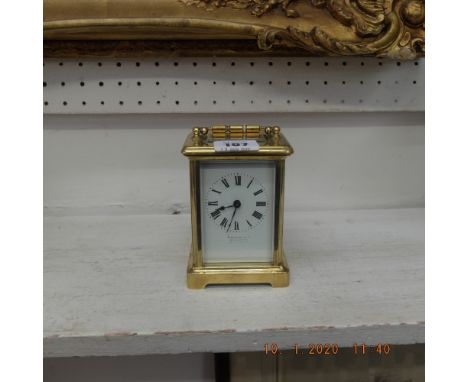 A brass cased Finnigans carriage clock