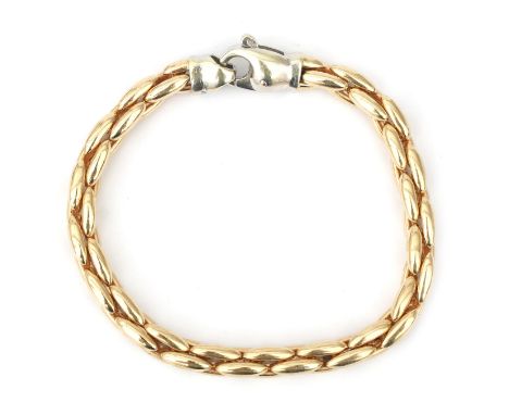 A 14 karat two tone gold rope link bracelet. Composed of a yellow gold rope link to a white gold lobster clasp. Gross weight: