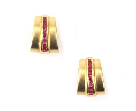A pair of 18 karat gold ruby earrings. Of trapezium shaped design featuring carré cut rubies. Gross weight: 14.4 g. ca. 20 x 