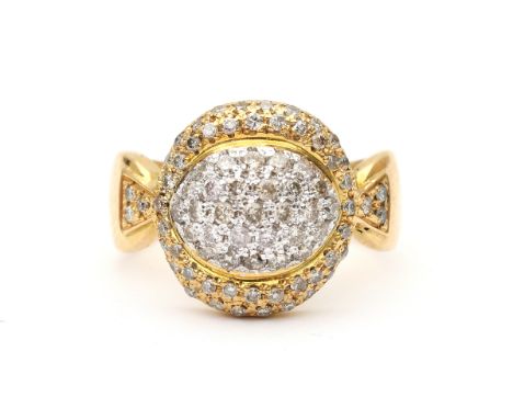 A two tone 18 carat gold pavé set diamond ring. The center part is made of white gold. Featuring ca. 0.75 ct. diamonds in tot