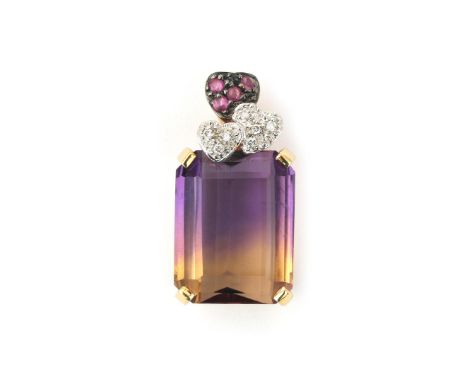 An 18 karat gold pendant with ametrine, diamond and ruby. Featuring an emerald cut ametrine of ca. 15 ct. and three pavé set 