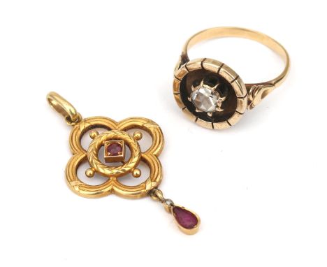 A 14 karat gold ruby pendant and a 14 karat gold rose cut ring. A Napoleon III style pendant with a pear shaped ruby suspende