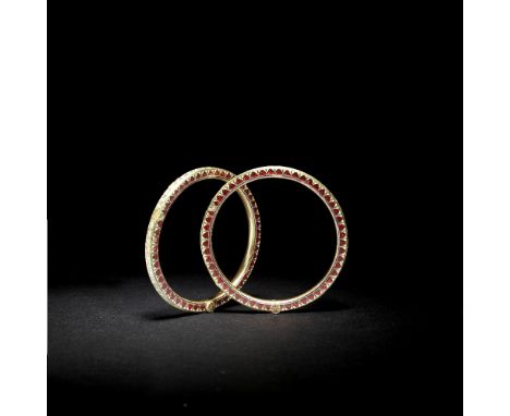 A pair of diamond-set gold bangles India, 20th Centuryeach of hinged circular form, the exterior set with diamonds in rectang