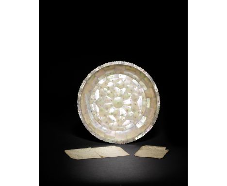 An Indo-Portuguese mother-of-pearl dish Gujarat, 16th/ 17th Centuryof shallow rounded form on a short foot, constructed from 