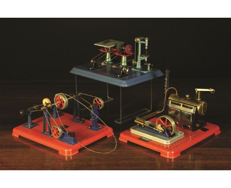A Mamod Model Free Standing Tin Plate Steam Engine driving four machines; two mechanical hammers, a double grinder and a doub