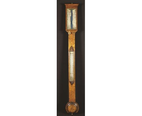 A Victorian Oak Cased Stick Barometer with ivorine scales and thermometer, 36½ ins (92 cms) in length.