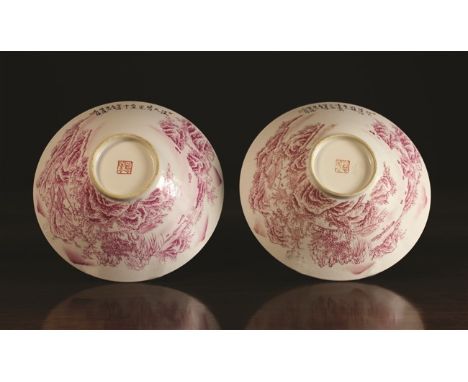 A Pair of Chinese Bowls decorated in puce enamel with landscape scenes, scribed in black with calligraphy and having a red se