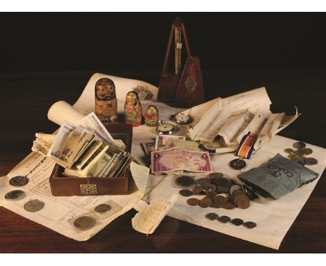 A Metronome, A Russian Doll painted as a Japanese man (A/F), Collection of Bank Notes, Coins, Medals and a tin canister of do