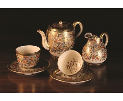 A Small Late 19th Century Satsuma Tête-à-tête Teaset with teapot, jug and two cups & saucers decorated with millefleur enrich