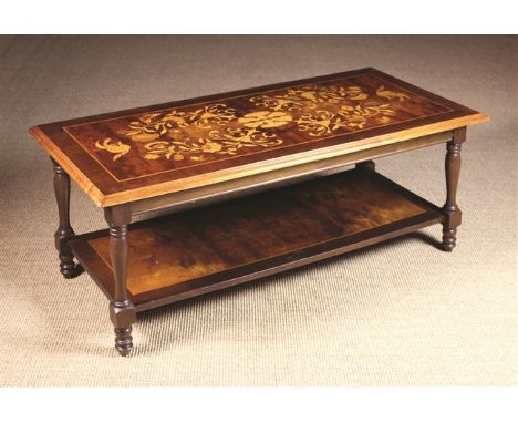 A Marquetry Coffee Table. The rectangular top inlaid with sprays of flowers & foliage within a cross-banded border and moulde