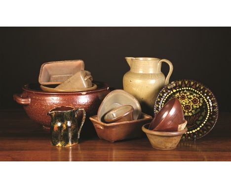 A Collection of Stoneware: A large treacle glazed circular planter with twin handles, 7 ins (18 cms) high, 15 38 cms) in diam