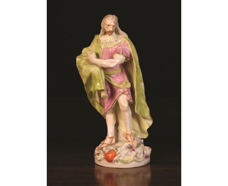 A 19th Century Hard Paste Porcelain Figure: King Lear wearing a long flowing pale green cloak over a pale puce tunic stood on