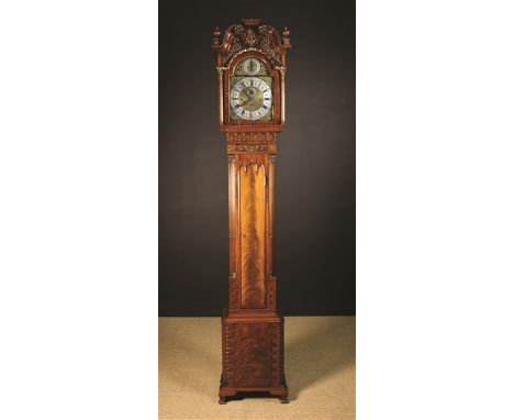 A Fabulous Quality Chippendale Style Flame Mahogany Long Case Clock. The case richly carved with scrolls of acanthus, rosette