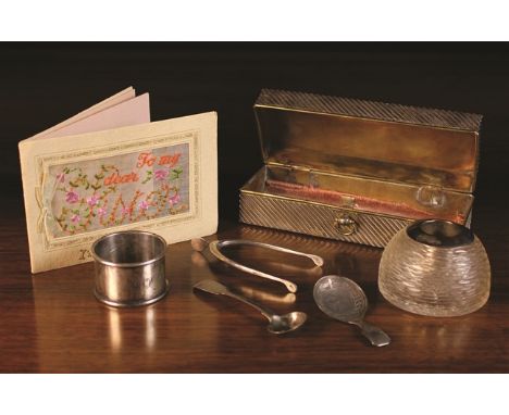 A Small Collection of Silver: A silver mounted cut glass inkwell hallmarked London 1896. A silver clad brass box of rectangul