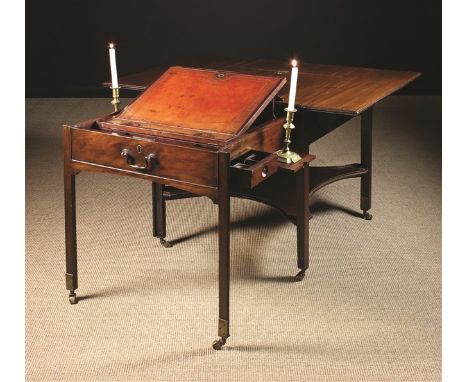 A Handsome 18th Century Georgian Mahogany Architect's Table. The top having drop leaves and a rising slope section with book 