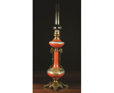 A 19th Century Ceramic Oil Lamp with gilt metal mounts The wick adjuster stamped BRENNER SOWSON. The oil font raised on a gou