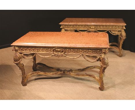 Two Large & Impressive Carved Giltwood Tables with rose marble tops: One a console, the other free-standing. Each table havin