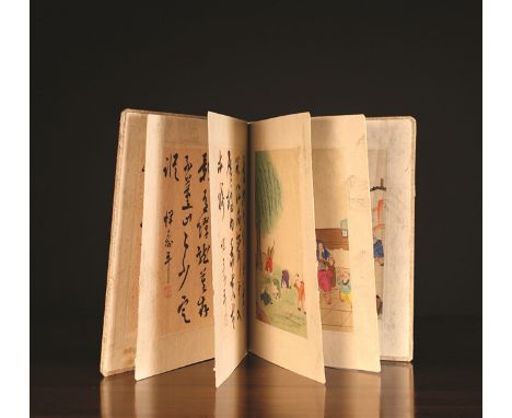 A Chinese Book/Folder, possibly 1930's (?). The folded pages each painted with calligraphy on a silver flecked ground to one 