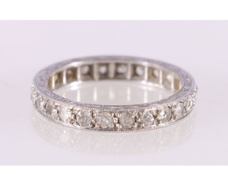 White metal diamond eternity ring with engraved shank possibly 18ct white gold, ring size M, 3.44gCondition Report:Unsure as 