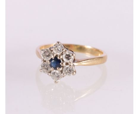 18ct yellow gold sapphire and diamond dress ring, the central faceted sapphire encircled by six round diamonds, each approxim