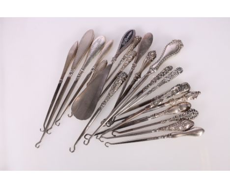 Twenty silver handled buttonhooks, one with matching shoe horn&nbsp; 