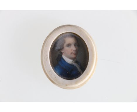 A small portrait miniature of a gentleman in a blue jacket, signed lower right with initials S.C 1768 (?), 3.5cm.Condition Re