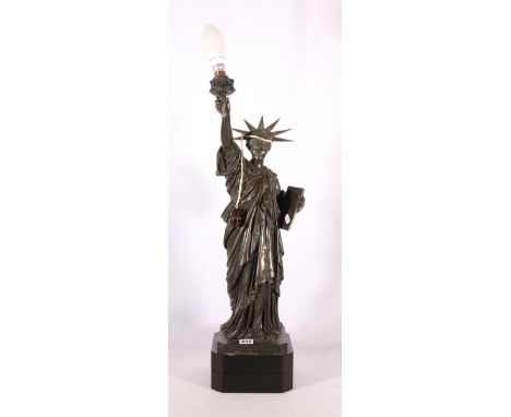 Metal table light in the form of the statue of liberty, 68cm tallCondition Report:No shade present. The figure is dirty throu