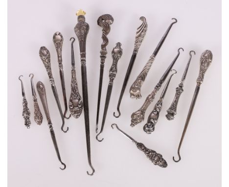 Sixteen silver handled button hooks, one with lion head finial, one with stork head set with ruby eyes etc.Condition Report:T