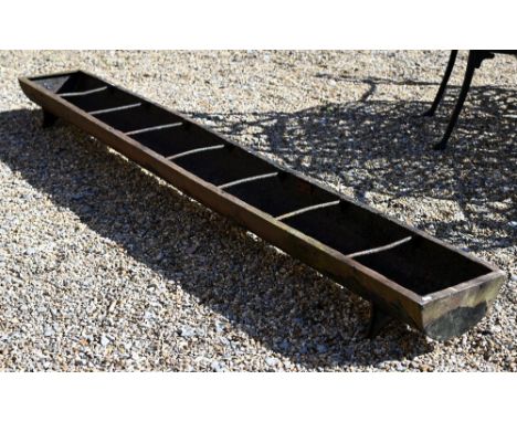 A Victorian cast iron trough feeder, raised on four cast legs, 244 cm long x 30.5 cm wide x 19 cm h 