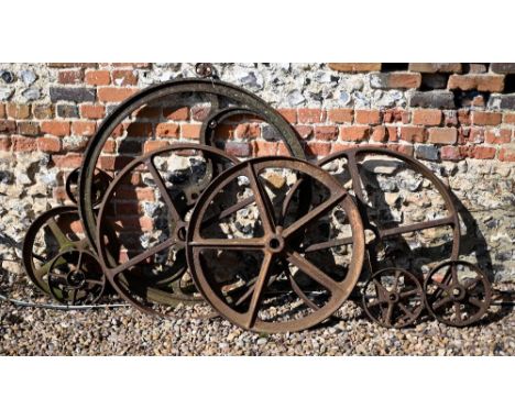 Assorted vintage cast iron spoked carriage/cart wheels etc in varying sizes, the largest 96 cm dia. all a/f (10) 