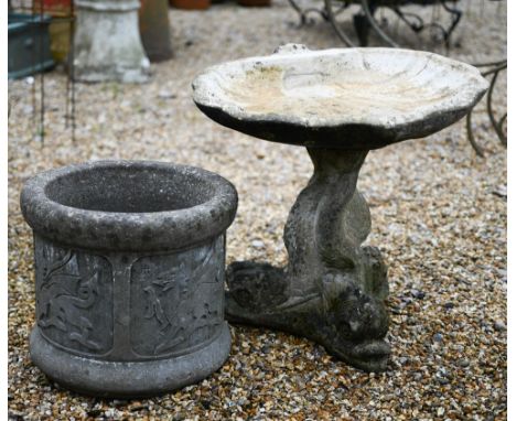 A cast stone scallop shell form bird bath raised on a dolphin base, weathered, 48 cm h to/with a cast stone tub planter (2) 