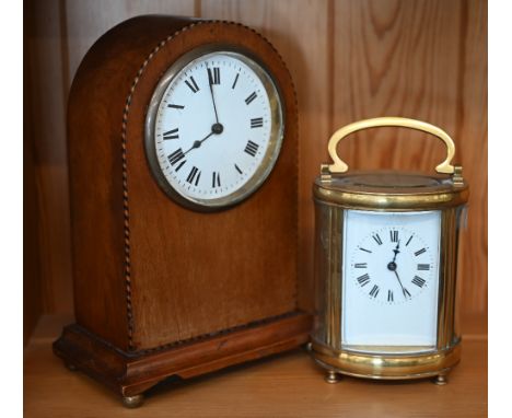 An oval brass carriage clock 16 cm high overall to/w an inlaid mahogany mantel clock with French movement (2) 