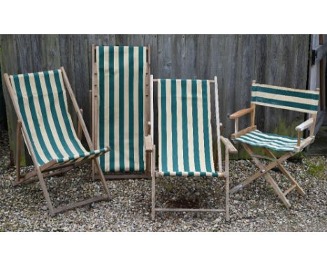 Three vintage green-striped deckchairs to/with a conforming folding table (4) 