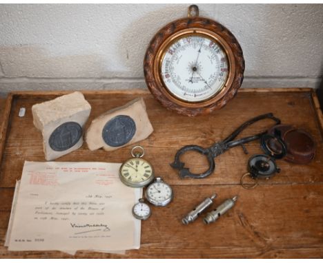 Two commemorative metal medallions mounted on shards of stone from the Houses of Parliament following air raid damage to/w a 