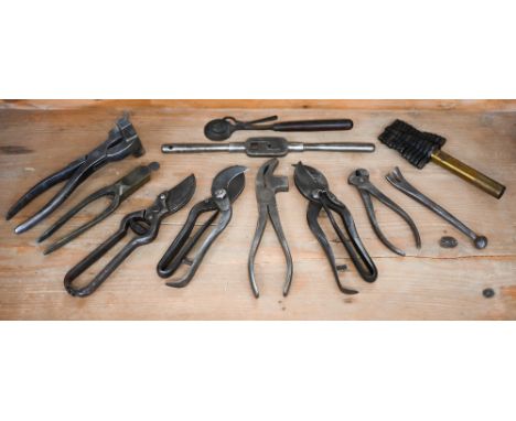 An interesting selection of antique tools, including bullet-mould with ball and bullet casts, secateurs, presses and crimps, 