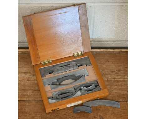 A boxed vintage set of twelve Figgins (London) letterpess angle quads 