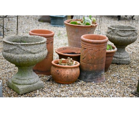 A pair of heavily weathered composite stone urn planters to/with an assortment of terracotta planters and a pair of vintage c