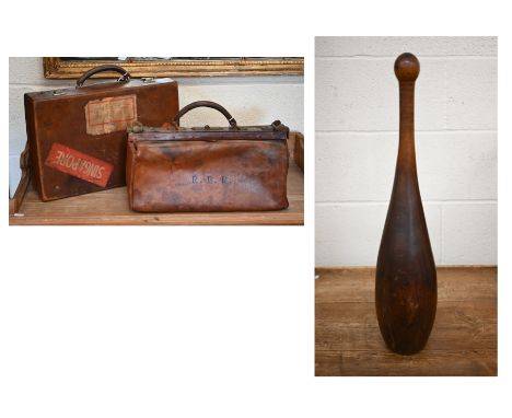 An antique lead-weighted exercise skittle, 65 cm high, to/w a small vintage leather Gladstone bag and a small leather suitcas