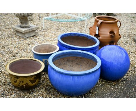 Two large blue glazed planters, 52 cm dia. to/with a blue glazed garden sphere, a glazed dragon planter and a salt glazed str