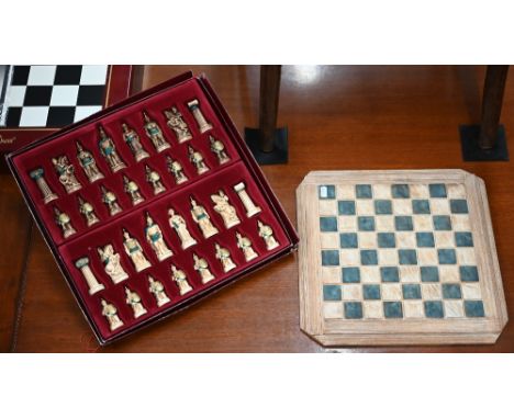 An Apma set of 'Greek Warrior' chessmen (boxed) c/w resin chessboard 