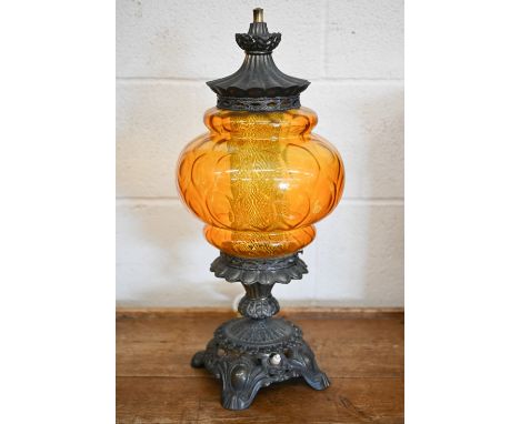 An ornate brass table lamp with moulded amber glass shade, 56 cm 