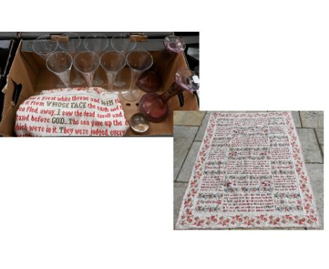 A large antique fabric panel, cross-stitched with religious texts within floral-printed surround, 162 x 114 cm to/w a set of 