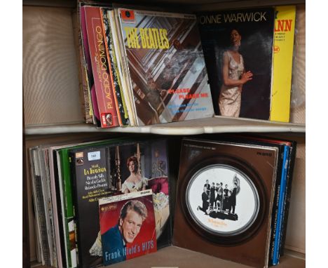 A quantity of vinyl LP records including The Buddy Holly Story, The Beatles Please Please Me, The Five Faces of Manfred Mann 