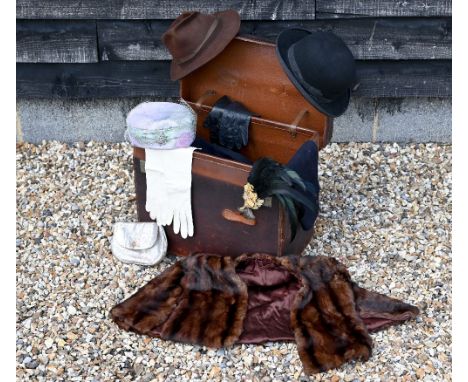 A leather boot-trunk containing a quantity of costume, including a vintage child's sailor suit by Rowe of Gosport, a Herbert 