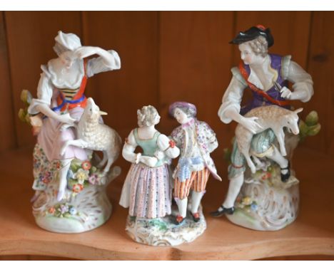 A pair of Sitzendorf porcelain figures - shepherd and shepherdess, 19 cm high to/w a smaller German group of a couple dancing