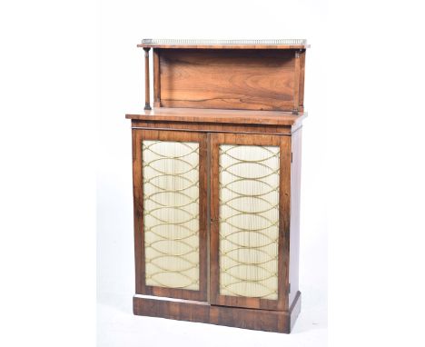 A William lV Rosewood chiffonierWith a brass galleried shelf supported on two ring turned tapering uprights above a rectangul