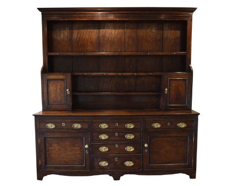 A stunning George III oak and mahogany cross banded high back dresserWith a Cavetto cornice above a mahogany cross banded fri