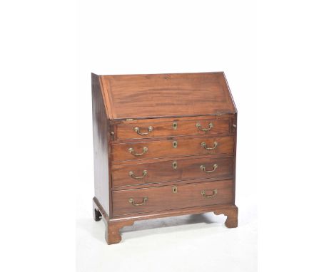 George III mahogany bureauThe hinged sloping fall front enclosing a fitted interior, above four graduated long drawers applie