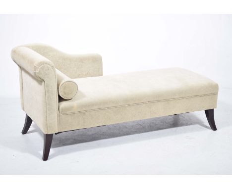 A 19th Century style green velour chaise longueWith a padded scroll end, shaped padded back, loose cylindrical cushion raised